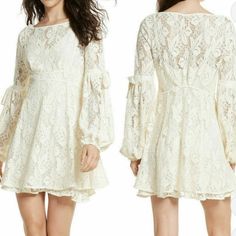 Free People Cottage Vintage White/Ivory Lace Mini Dress! (Never Worn!) Retail Price: $159 -Size: M (True To Size!) Imagined In Delicate Floral Lace, The Sleeves Of The Ruby Mini Dress Are Gently Ballooned With Satin Drawstrings.Flared Skater Dress Type And Includes Detachable Slip/Second Layer With Ruffle (Shown In 4th Photo). Measurements: Bust 18 In Waist 15 In Lenght 31.5 In-Not Including The Slip With Lace Ruffle Bottom That’s Adding 2 In More ,If Wear With It. -Please Send Legit Offers :) # Cream Lace Mini Dress With Lace Trim, White Long Sleeve Prairie Dress With Lace Trim, White Vintage Long-sleeve Dress With Lace Trim, Cream Lace V-neck Mini Dress, Flowy Off-white Mini Dress With Lace Trim, Vintage Mini Dresses, Lacey Dress, Free People Mini Dress, Lace Ruffle