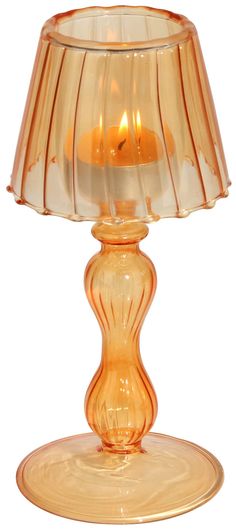 an orange glass table lamp on a white background