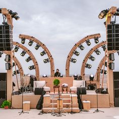 an outdoor stage set up with speakers and lights