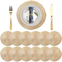 a set of six place settings with gold forks and spoons in front of it