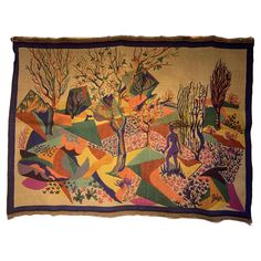 an old tapestry with trees and people in the woods on it's border,