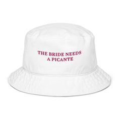 The Bride Needs A Picante 🌶️ Embroidered Bucket Hat Spice up the bachelorette party with the The Bride Needs A Picante embroidered bucket hat! Perfect for the bride who loves her tequila cocktails with an extra kick, this trendy hat is ideal for hen parties, Mexican-themed bachelorettes, and wedding celebrations. Whether sipping on spicy margaritas or dancing the night away, this bucket hat brings fun and flair to the bride's big celebrations. Key Features: 🌶️ 100% Cotton Comfort: Made from so Mexican Bachelorette, Spicy Margaritas, Margarita Gifts, Cocktails Wedding, Party Bucket, Embroidered Bucket Hat, Hen Party Gifts, Poolside Party, Spicy Margarita