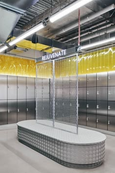 an empty room with metal lockers and a sign that reads rejuvenate