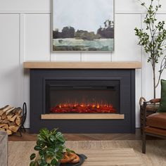 a living room with a fire place in the center and a painting on the wall