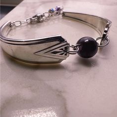 Step Into The Past With This Stunning Vintage Spoon Bracelet, Meticulously Crafted From Authentic Deauville Silver-Plated Spoons Dating Back To 1929. Handmade By One Ida, This Exquisite Piece Exudes Timeless Charm And Elegance. Adorned With A Captivating Amethyst Accent, This Adjustable Bracelet Adds A Touch Of Sophistication To Any Ensemble. Specifications: Material: Silver-Plated Spoons Year: 1929 Maker: One Ida Gemstone: Amethyst Adjustable Sizing For A Comfortable Fit Embrace Vintage Glamour Cutlery Crafts, Make Spoon Rings, Vintage Spoon Jewelry, Spoon Jewelry Diy, Flatware Crafts, Silver Spoon Bracelet, Craft Hacks, Silver Spoon Jewelry, Silverware Crafts