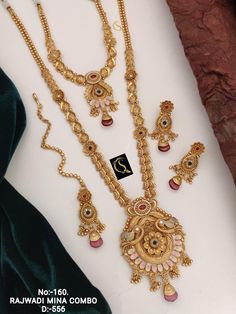 Description :- Long Choker Indian Traditional Wedding Bridal Wear Gold Plated Necklace Earrings Tika Kundan Diamond Fashion Jewelry Set 2 Piece Combo Set The biggest highlight of this manalis necklace set lies in its detailing. The designers at Tarinika have put meticulous attention to details in order to perfect the detailing of the unique and intricate design. The bead-like design of the necklace's chain fuses ethnic style with contemporary flairs. 100% Satisfaction Guarantee: 1 Year Warranty, Luxury 22k Gold Jewelry Sets With Intricate Design, Luxury 22k Gold Temple Bridal Necklace, Temple Jewelry Sets With Peacock Design For Weddings, Gold Peacock Design Jewelry Sets For Weddings, Gold Set Design, Indian Traditional Wedding, Tika Jewelry, Necklace Set Indian Bridal Jewelry, Antique Gold Jewelry Indian