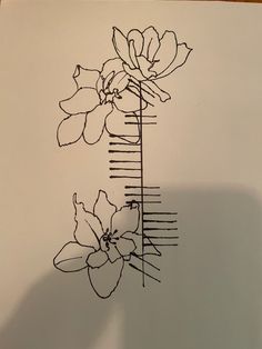 a drawing of two flowers on top of a piece of paper that is drawn in black ink