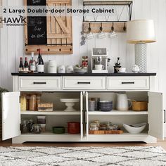 a kitchen with two large double door storage cabinets