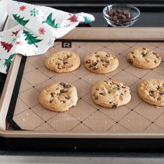 chocolate chip cookies on a cookie sheet ready to go into the oven for christmas baking