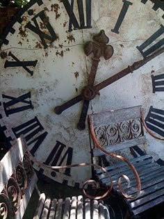 an old clock with roman numerals on it