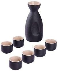 a set of six black vases and cups