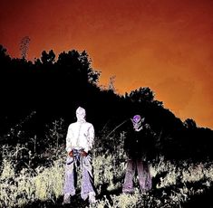 two people standing in tall grass with trees behind them and an orange sky above them