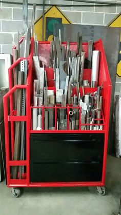 a red tool cart filled with lots of tools