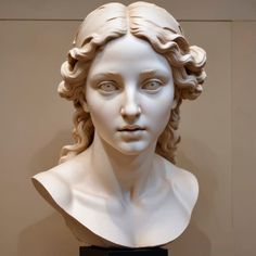 a bust of a woman with curly hair