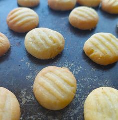 some cookies that are sitting on a cookie sheet and ready to go into the oven