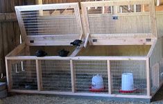 two large cages with birds in them on top of the floor next to each other