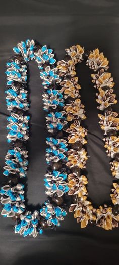 Ribbon lei that you can order for graduation, birthdays, mothers day, or any special occasion. It's made to order and takes about 2 weeks to make and ship. if you don't see a color choice let me know what color you want upon ordering. Lei For Graduation, Kukui Nut Lei, Money Leis, Ribbon Lei, Graduation Leis, Homecoming Mums Diy, Kukui Nut, Money Lei, Homecoming Mums