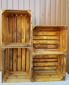 two wooden crates sitting next to each other