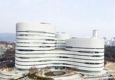 an aerial view of two large buildings in the city