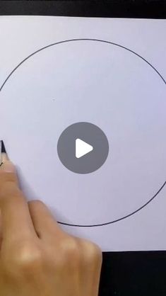 someone is drawing an image on a piece of paper