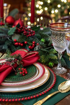 a christmas table setting with red and green place settings