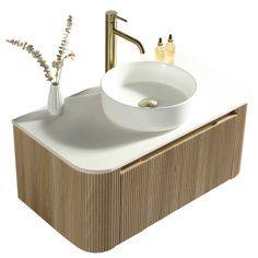 a white sink sitting on top of a wooden counter next to a faucet