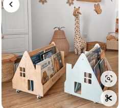 two wooden toys are on the floor in front of a white wall and some bookshelves