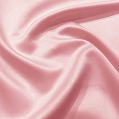 a close up view of a pink satin fabric