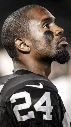 a close up of a football player wearing a number 42 jersey and looking off into the distance