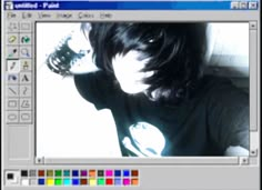 an image of a person with long hair in the computer screen shot, which appears to be blurry