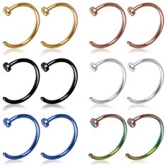 six pairs of surgical piercings in different colors