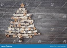 a christmas tree made out of wine corks on a wooden background stock photo image