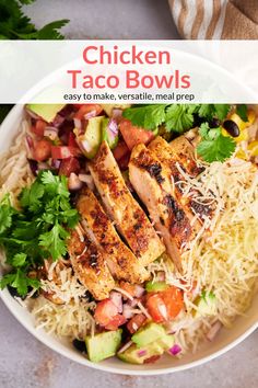 a white bowl filled with chicken taco bowls next to cilantro and avocado