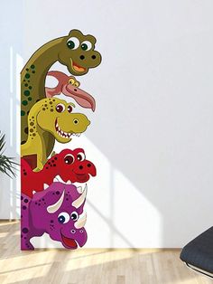 a wall sticker with an assortment of dinosaurs on it