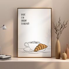 a coffee cup with a croissant on it