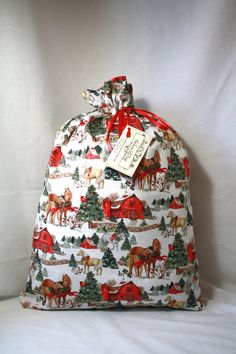 a white bag with horses and trees on it