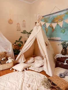 a teepee tent sitting on top of a wooden floor