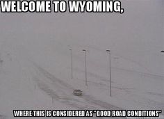 a car driving down a snow covered road in the middle of winter with words written below it