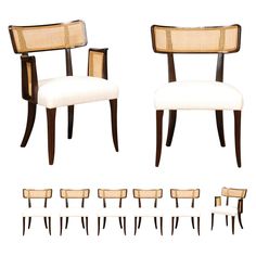 a set of six chairs with cane back and armrests, all in white upholstered fabric