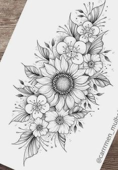 a black and white drawing of flowers on paper