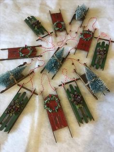 a group of wooden sleds with christmas decorations on them