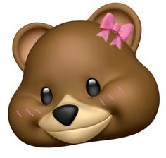 a brown teddy bear with a pink bow on its head