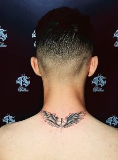 a man with a tattoo on his back neck