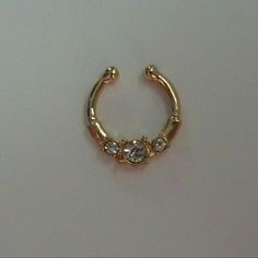 This Is A Gold Colored Fake Septum Ring With Clear Crystals. G6 This Is A Boutique Item. Bundle Any Three $7 Or $8 Items And Offer Me $16 And I Will Accept! Septum And Nose Ring, Fake Septum Ring, Gold Septum, Fake Nose Ring, Fake Lips, Fake Nose Rings, Fake Nose, Lip Piercing, Ring Color