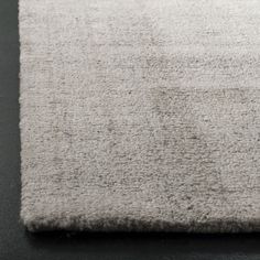 a white rug on top of a black table