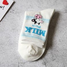 If you know South Korean culture, then you know it is customary to remove your shoes when entering a Korean household. With that in mind, Koreans love to sport stylish socks!These Fun Milk Flavor Design Crew Socks are no exception. Get your feet all cute and comfy with our breathable and sweat-absorbing flavored milk themed crew socks!• Color: Multicolor• Pattern Type: Milk• Composition: 70% Cotton, 25% Polyester, 5% Spandex• Material: Cotton Blends• Size: Women's EU35-40/US5-8.5• Type: Crew Socks• Socks Quantity: 1 pair per orderWe want you to be 100% satisfied, so please let us know if there is anything wrong with your order so we can fix it. Casual Blue Socks With Letter Print, Cute White Non-slip Socks, Cute White Socks With Letter Print, White Fun Non-slip Socks, Fun White Non-slip Socks, White Cotton Socks As A Gift, White Cotton Socks As Gift, White Cotton Socks For Gifts, White Non-slip Fun Socks