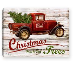 an old red truck with a christmas tree in the back and holly farms written on it