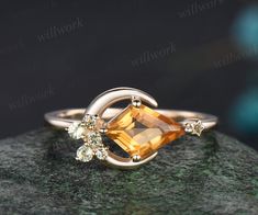 Symbolizing the magic of love under moonlit skies, this enchanting ring features a gleaming citrine gemstone reminiscent of a radiant moon, adorned with delicate star that illuminate the path of your shared journey. The main stone is a 6x9mm kite cut natural citrine. The accent stones are round cut natural peridot. Thi Peridot And Citrine Ring, Big Gem Ring, November Ring, Alt Rings, Yellow Wedding Ring, Moon Wedding Ring, Citrine Promise Ring, Citrine Wedding Ring, Citrine Rings