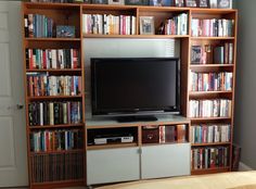 there is a television on top of the bookshelf