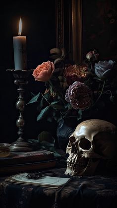 a skull sitting on top of a table next to a candle